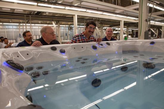 Michael Phelps tours the Master Spas factory to view production of the Michael Phelps Signature Swim Spa.