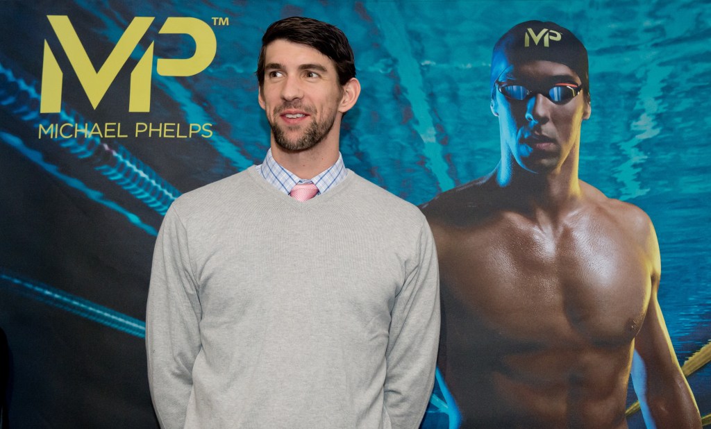 US  swimmer and Olympic champion Michael Phelps speaks at a press conference as part of the ISPO sporting equipment trade show in Munich, GermanyFriday Feb. 6, 2015. In conjunction with the manufacturer Aqua Sphere, Phelps is presenting his own range of swimming equipment at the show. (AP Photo/dpa,Sven Hoppe)