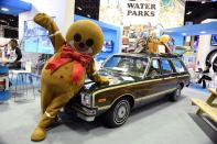 Murphy, the Give Kids the World mascot, strikes a pose with Olive.