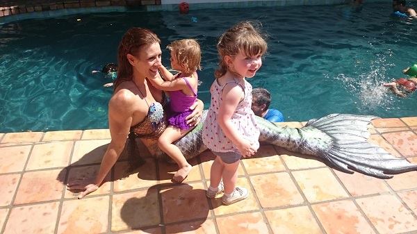 A professional mermaid entertains children at a birthday party in the San Fernando Valley. Iridescence: A Mermaid Tribe does more than 20 events a year.