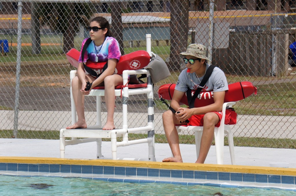 March, 2015: Eliana Villarreal, 14, watches over the pool alongside her brother, lifeguard Nino Villarreal, during the lifeguard shadowing" portion of the Junior Lifeguarding class as part of the Red Cross Centennial Campaign in at a Brevard County Parks and Recreation facility in Florida.