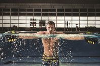 Rippling Effect: Speedo FIT's marketing campaign features striking imagery such as Olympian Ryan Lochte seen here using Clutch Paddles, one of several products in the brand's line of water workout gear.