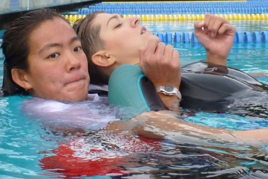 Sometimes the challenge is for one lifeguard to tow another, presenting as an unconscious victim, across the pool quickly and safely.