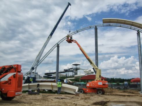More fiberglass sections are lifted into place and attached to the spline.