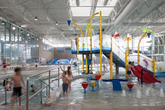 A play structure draws smaller users, while the surf-simulation machine (seen in the background) provides an experience that’s unique in the area and attracts plenty of spectators. The skylight allows as much natural illumination as possible.