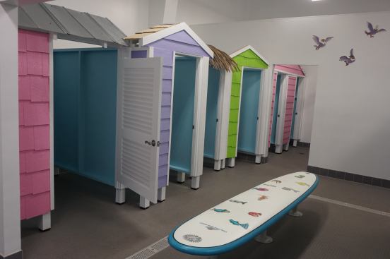 The cabana-style changing rooms continue the ocean theme and engage children with bright colors and multiple textures.