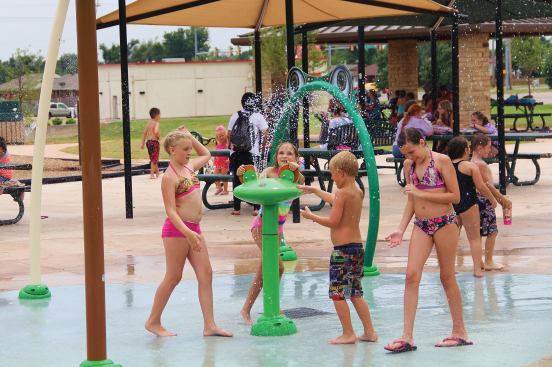 Reduced-consumption nozzles and spray heads help keep water use down, as do touch bollards, which allow users to activate the features only when needed during pre-set operational hours. The stainless steel spray elements and plastics are recyclable at the end of their life spans, and brass spray heads and nozzles contain no lead. The park is irrigated from a waterfeature that traverses the length of the splashpad. To finance the project, voters agreed to a four-year 0.25-cent sales tax increase.