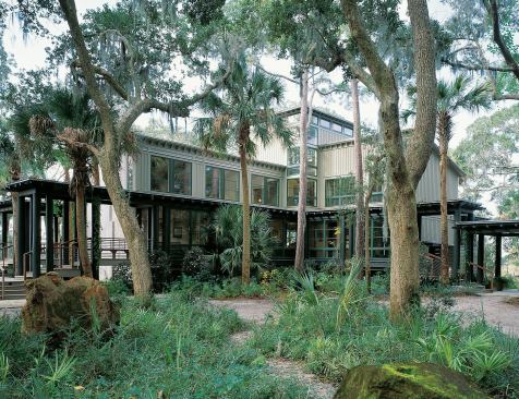 Traditional Carolina Low Country forms and native plantings give this new home a settled-in feeling that belies its recent completion date.