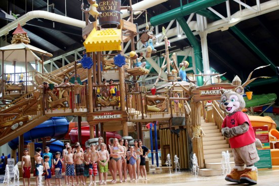 Wiley the Wolf and resort guests anticipate the first official bucket tipping during the grand opening of the new Great Wolf Lodge Southern California resort in Garden Grove, Calif., on Friday, March 4. 