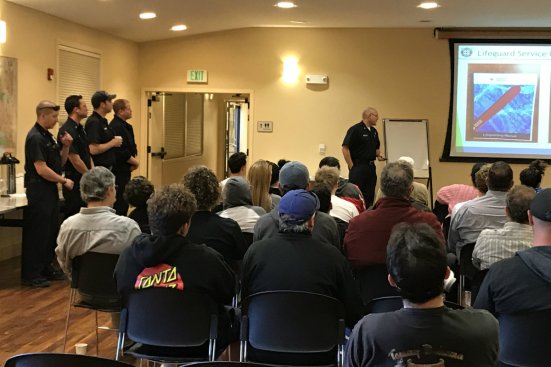 Pete DeQuincy, aquatic manager for the East Bay Regional Park District, makes a presentation about the lifeguarding department at a new-hire orientation.