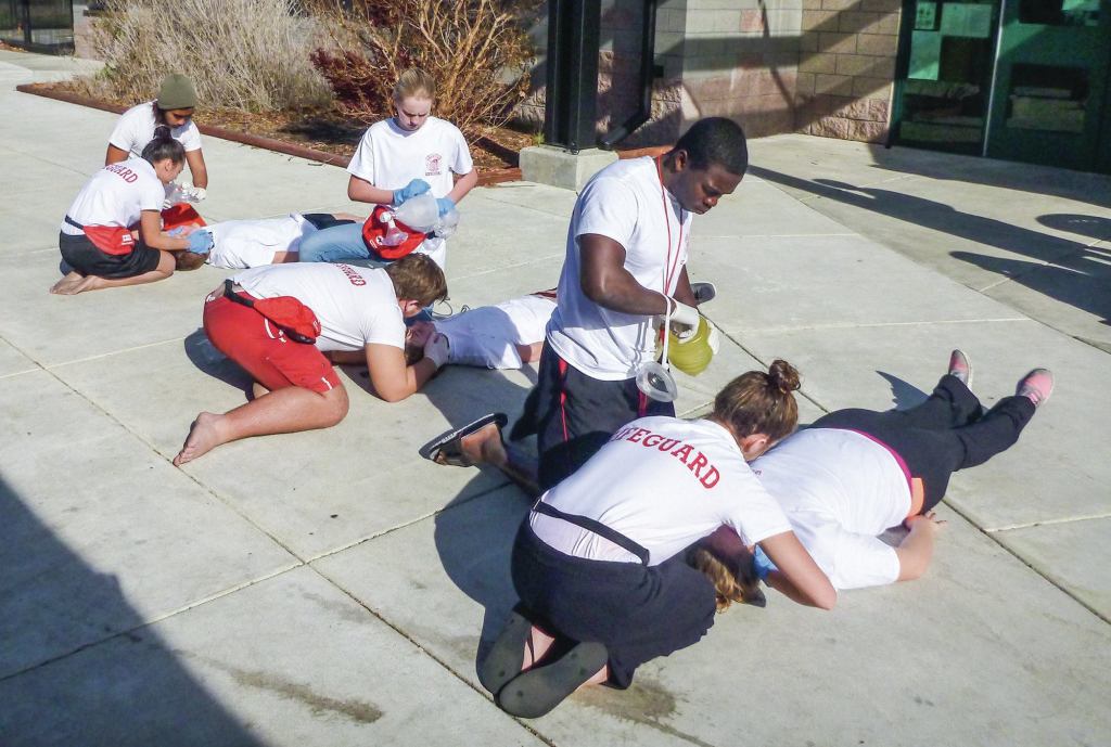 Rescuers in Action: When checking for breathing and pulse in the cephalic position, remember to continue to look down the victim's chest.