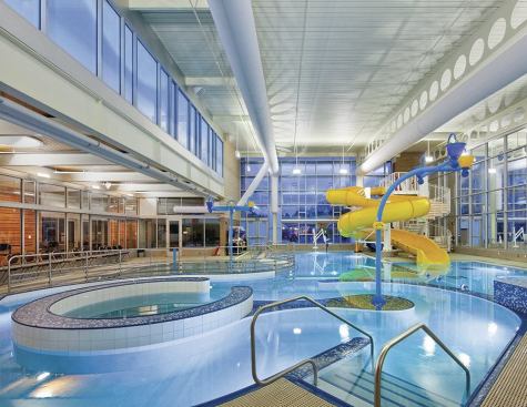 The designers say: “The architectural theme is a neutral enclosure surrounding sparking pools of water, with varied tile, lighting and colorful aquatic features.  The overarching goal was to connect this setting to other exterior and interior spaces.”