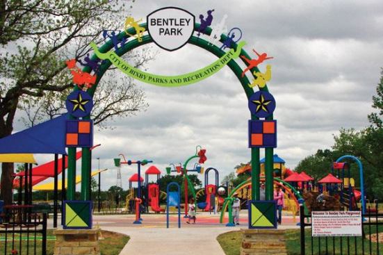 Located adjacent to the

Arkansas River, the Bentley Park spraypark is the centerpiece of

the 100-acre Bentley Park Sports Complex, which also includes a dry

playground, soccer and baseball fields, sand volleyball and

horseshoe pits. The spraypark was designed to promote

cross-generational and collaborative play. Families enter through

an inviting, colorful gateway arch. Once inside, the aquatic

experience encourages imagination with colorful waterfeatures and a

unique play surface featuring graphics of a sun, moon, stars and

swirls.