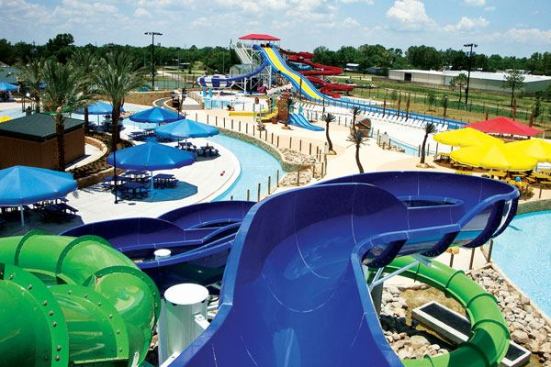 Innovative energy savings features at Pirate’s Bay include the use of regenerative media filters and variable-speed-drive pumps. Continuous gutters on the extra-long, 600-linear-foot lazy river help reduce maintenance. The deck was patterned with saw joints and finished with a low

maintenance broom finish concrete for slip resistance. Wet areas at spray pads and the zero-depth beach entrances were finished with a colored acrylic cement-textured deck topping. 