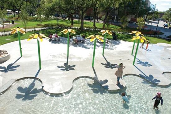 The interactive spray deck,

which includes cannons, activators and 10-foot-tall Daisy Mae

sprayers, is located adjacent to the wading pool. As a result of

community input, the spray elements are on a flow-through system,

designed to be operated independently from the wading pool. Even

when no lifeguard is available to supervise the wading pool, both

waterfeatures can remain operable.