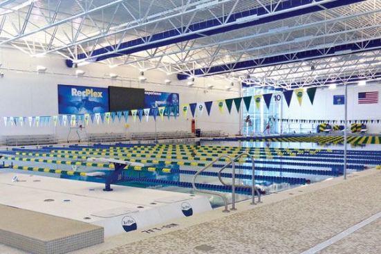 The RecPlex Aqua Arena is on track to receive LEED Silver Certification, and has been awarded an incentive grant in excess of $50,000 by Wisconsin’s Focus on Energy Program in recognition of its energy-saving accomplishments. The most innovative energy-saving feature, a lake loop geothermal system, features nearly 12 miles of coiled tubing, submerged to the bottom of the adjacent lake, which heat and cool the building, pool and domestic hot water. This, along with increased wall and roof insulation, triple pane glazing, energy efficient lighting, and an energy recovery system, allow the building to achieve a nearly 50 percent yearly energy savings vs. the same building constructed to a building code minimum baseline. Other sustainable building practices including significant use of local and recycled materials, day lighting strategies and low VOC content finishes.