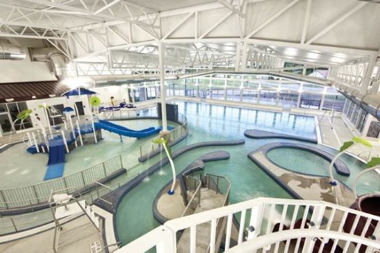 The goal was to create a

new multiuse recreation facility for residents and guests of the

city of Burleson, Texas, a fast-growing suburb of Fort Worth. The

central aquatic amenity is a 5-lane-by-25-yard lap/leisure pool.

There’s also a water play area for kids and dry amenities

including two basketball courts with an elevated jogging track,

weight and exercise room, an aerobics/dance studio, a lounge, two

meeting rooms with outdoor patios, and two party rooms. The project

is a partial collaboration with the local school district, which

covered the cost for three additional lap lanes and a swim team

“ready” room.