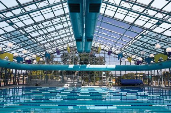 TThe facility has received LEED Gold Certification for its sustainable design. Green features include the use of daylight throughout the facility,energy-efficient pool heaters, light fixtures, space conditioning equipment, direct digital controls, thermal pool covers, a UV pool water filter system, and low water use plumbing fixtures. A dehumidification unit conditions the natatorium area. Dehumidification is achieved with 100 percent outside air, which creates better air quality and saves energy compared with a mechanical dehumidification system.