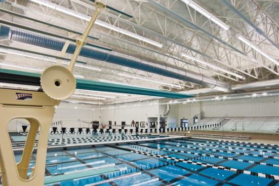 The pool is designed for eight 50-meter lap lanes, eight 25-yard, or eight 25-meter lap lanes, depending on the moveable bulkhead location. The width accommodates as many as 23 lap lanes measuring 25 yards each, or two sets of eight 25-yard lap lanes, depending on the moveable

bulkhead location. Large swim meets are not the focus of the facility, but there is elevated spectator seating for 400.  The seating area features glass railings, helping eliminate obstructed views of the pool, and state-of-the-art“tube” lighting is used to illuminate the interior of the pool space. There are no exterior windows.