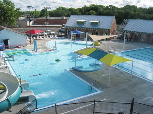 The team sought a design that could accommodate citizens of all ages. Interactive features are placed in the generously sized zero-depth entry to appeal to toddlers, while water slides, a floatable walk and diving board bring in the pre-teens and teenagers. A large recreational space with shaded water bench gives adults the chance to relax while watching their children. An eight-lane, 25-yard pool with ample decking plays host to weekly swim competitions.